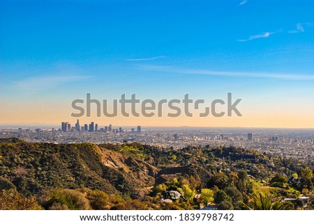 View from the hills about the city of Los Angeles on the evening with warm light.