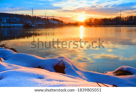 the beginning of winter at sunset on the river Siberia Russia