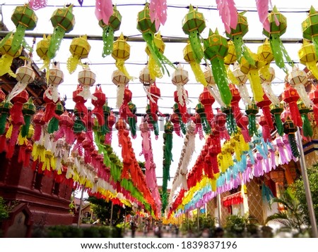 Many colorful Northern Thai paper lanterns in Happy Lantern Festival. It's part of Loi Krathong tradition. That has been practiced for long time to offer as Buddha offering at Phra That Hariphunchai.