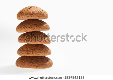 A stack of oatmeal cookies. White blank for text. Advertising design