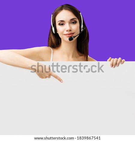 Call Center Service. Customer support or sales agent. Caller or receptionist phone operator pointing at sign board with ad copy space. Helping, answering, consulting. Violet purple color background.