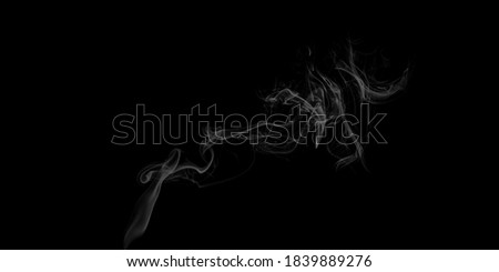 Abstract white puffs of smoke swirls overlay on black background pollution. Royalty high-quality free stock photo image of abstract smoke overlays on black background. White smoke swirl fragments 