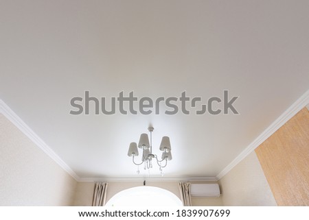 Classic white matte ceiling in the hall
