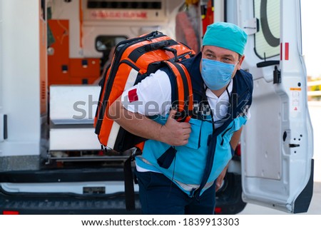 Emergency aid team preparing for emergency response to the patient in the ambulance Royalty-Free Stock Photo #1839913303