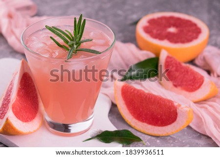 Grapefruit drink with ice.
Close-up.