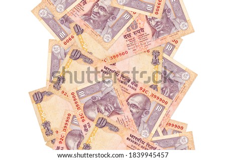 10 Indian rupees bills flying down isolated on white. Many banknotes falling with white copyspace on left and right side