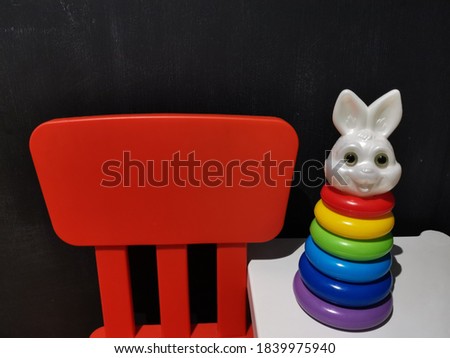 Children's toys on the white table, Black background 