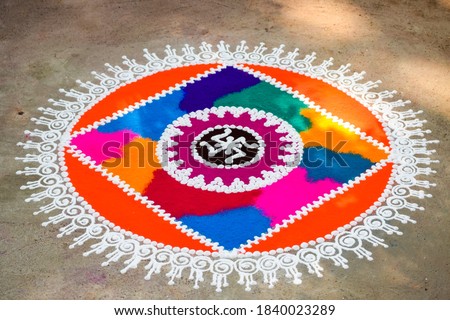 Rangoli is an art form, originating in India. The patterns are created on the ground or floor using colours of quartz, flower petals, rice etc during the Diwali or any other Indian festival.