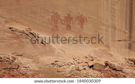 Red Pictographs, painted on a cliff face, by Native American Indians viewed from the Calf Creek Trail, Escalante, Utah, USA Royalty-Free Stock Photo #1840030309