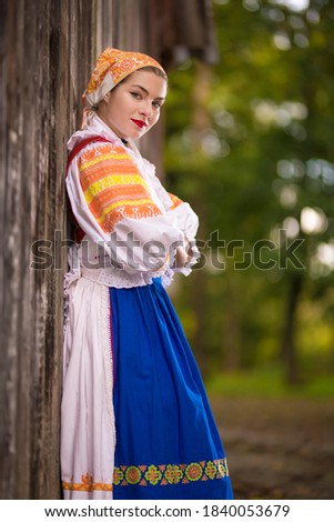 Detail of woman dress. She is wearing traditional Eastern Europe folk costumes. Slovak folklore. Slovak folk dancer. Beautiful woman.