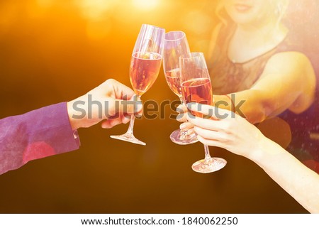 Two glasses of champagne with lights in the background. christmas background