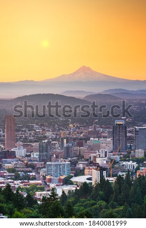 Portland, Oregon, USA skyline at dusk with Mt. Hood in the distance.