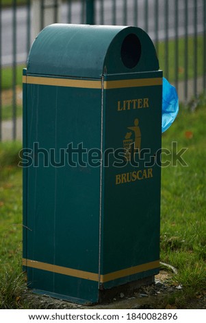 Outdoor ,litter bin in green color in the park