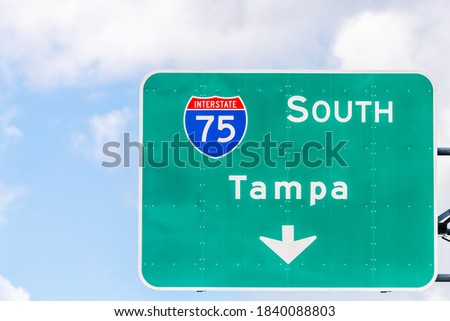 Tampa, USA road street interstate highway green sign for i75 south to Tampa Florida with text isolated closeup and sky