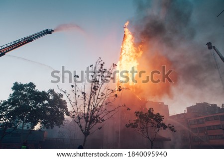 Church burns during a protest in Chile Royalty-Free Stock Photo #1840095940