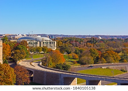 Washington DC panorama as seen from the Potomac River waterfront building in autumn. Park zone around US capital city downdown.