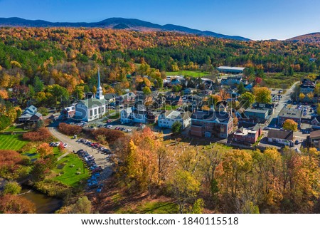 Aerial view of charming small town Stowe in Vermont. Mountains with fall multicolor trees Royalty-Free Stock Photo #1840115518