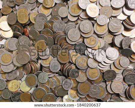 Top view of the coins is 10 baht, 5 baht, 1 baht, together.Thai baht. Royalty-Free Stock Photo #1840200637