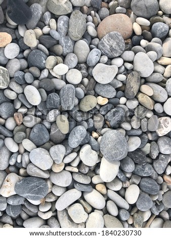 gray pebbles on the beach background texture