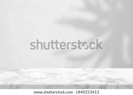 White Marble Table with Tree Shadow on Concrete Wall Texture Background, Suitable for Product Presentation Backdrop, Display, and Mock up.