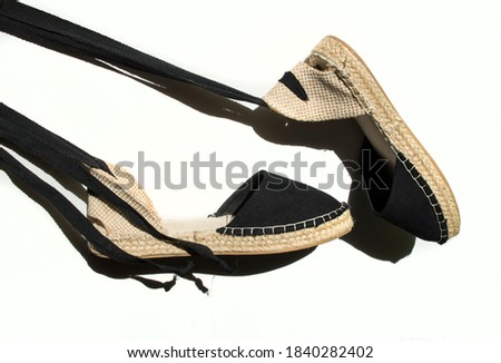 Women's espadrilles shoes, black on white background. Royalty-Free Stock Photo #1840282402