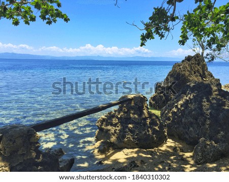 Calm Sea Surrounded By Rock Formations