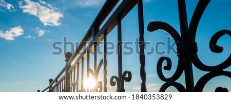 The metal fence along the river Royalty-Free Stock Photo #1840353829