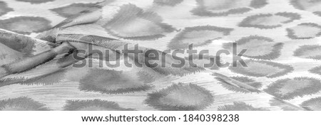 monochrome silk fabric, cheetah skin, african savannah theme. Background texture, pattern
