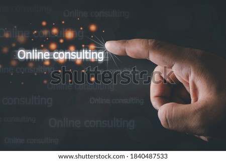 Close up of businessman finger pointing to online consulting for help sign. Concept of business