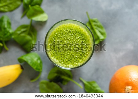 Spinach smoothie with orange, grapefruit and banana.