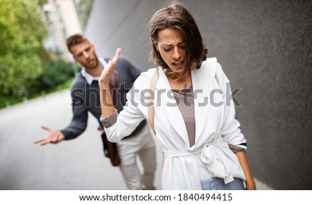 Breakup of couple with man and sad girlfriend outdoor. Divorce, couple, love, pain concept. Royalty-Free Stock Photo #1840494415