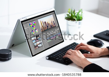 Video Editor Or Designer Using Editing Software Tech On Computer Royalty-Free Stock Photo #1840535788