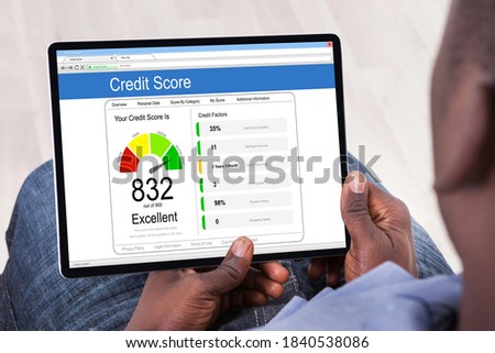 Online Credit Score Check Using Tablet Computer Royalty-Free Stock Photo #1840538086