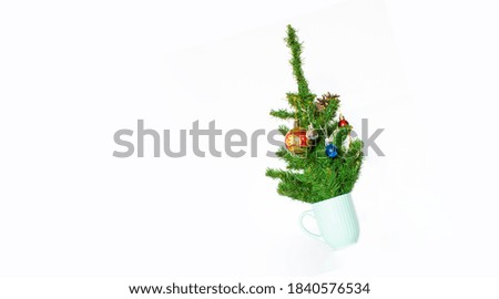 Coffee cup with Christmas tree. Minimal winter holidays concept.