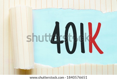 The text 401k appearing behind torn white paper
