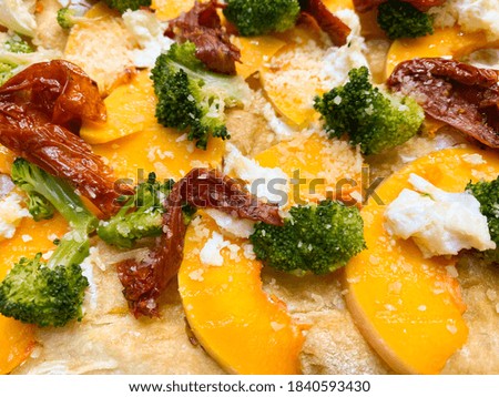 Italian fast food. Delicious hot pizza sliced and served on wooden platter with ingredients, close up view. Menu photo.