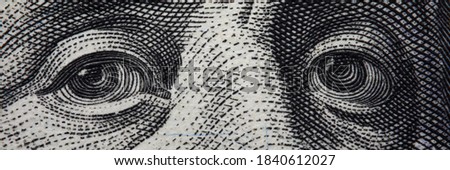 Close-up of benjamin franklins face on hundred banknote. Macro shot of grey facial composition of famous human. Business and investment. Money and finance history concept