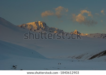 Snowy, high-mountainous Suusamyr valley, mountainous Kyrgyzstan, selective focus