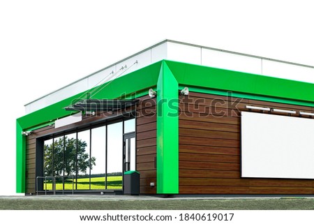 New building of a small cafe in green and brown colors. With large storefronts and a Billboard