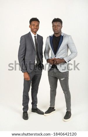 two handsome african men in suits on a white background