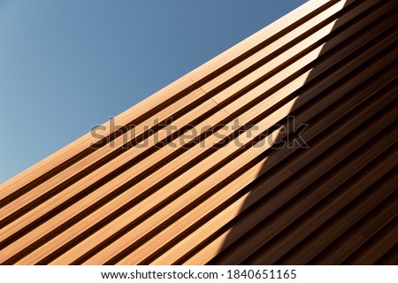 line of wood in detail building and blue sky abstract architecture background Royalty-Free Stock Photo #1840651165