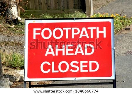 Foodpath ahead closed sign expecting road work in process soon.