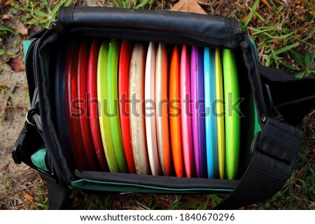 Picture of a bag full of disc golf discs