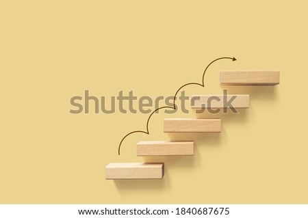 Growth or increase design concept. Cube block staircase moving step growing up to target. Success achievement or goal business motivation