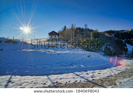 winter landscape with mountain lake and mountains, photo as a background , in the italian european dolomiti alps mountains in vicenza north italy, europe