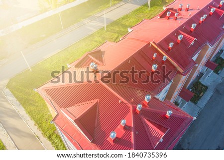 iron roof of the building and air ducts photo taken from a drone