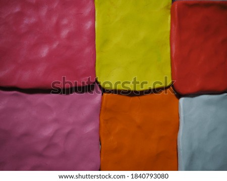 Bright plasticine textures for the background image.