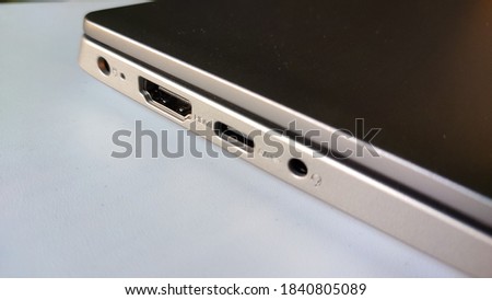 laptop side view.this is a picture of laptop on white background.the laptop had different ports at the side. 
