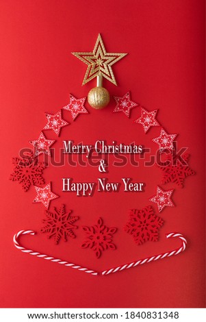 Top View Christmas background. Many Christmas decoration on background such as red Snowflakes, candy cane with text "Merry Christmas and Happy New year" on Red color background