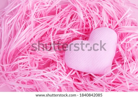 Gentle Valentine's Day background. Hearts on a pink background. Happy holiday greetings concept. Place for text. Flat layout.